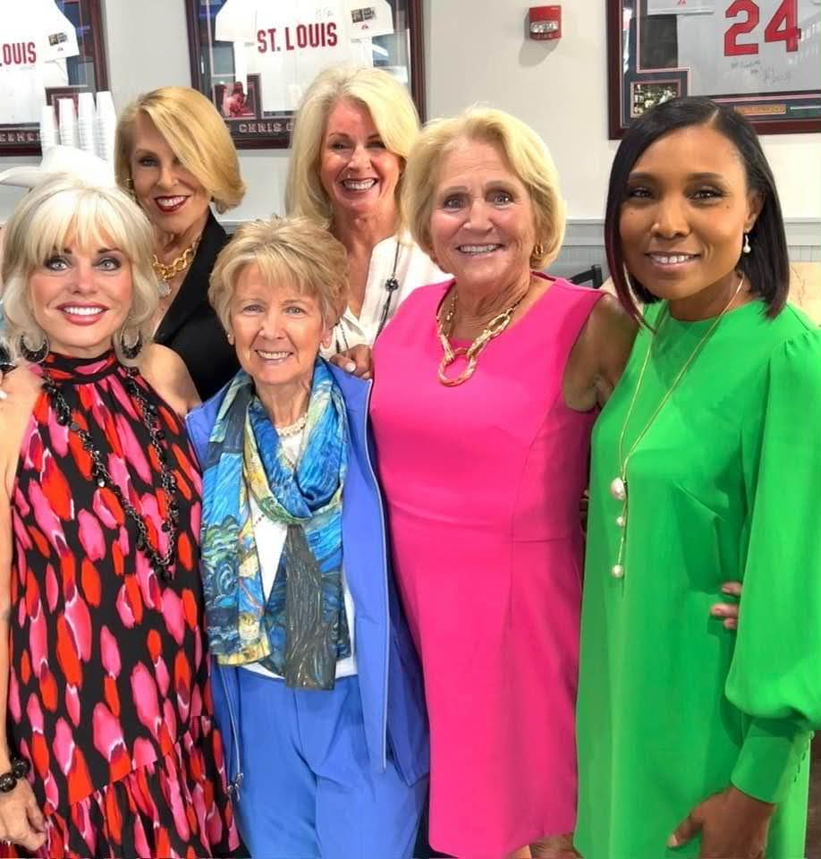 Camisha with a group of women at a community event