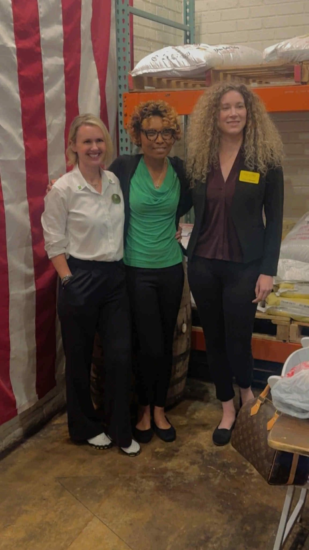 Camisha volunteering with partners at a community food bank